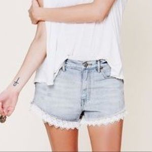 Free people light wash lace trim shorts